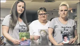  ?? FRAM DINSHAW/SALTWIRE NETWORK ?? Kevin Martin’s mother Bonnie Thomas, middle, and her surviving children Samantha, left, and Danielle hold up pictures of their loved one at the Stellarton Legion last Saturday.