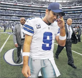  ?? Tony Romo threw for four TDs last weekend, but Dallas still lost to the Saints in overtime. The loss means Sunday night’s game at the Redskins will decide the Cowboys’ playoff fate. SHARON ELLMAN / ASSOCIATED PRESS ??