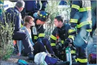  ?? BRENDAN MCDERMID / REUTERS ?? An injured woman is aided by first responders after a terrorist attack on Tuesday in New York City.