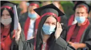  ?? AP-Andreea Alexandru ?? Students of the the Polytechni­c Institute wear face masks during the graduation ceremony for the 2020 university year in Bucharest, Romania on Sunday. Romania has registered a growing number of COVID-19 infections over the past week, with the highest levels since the pandemic started in the country in February.