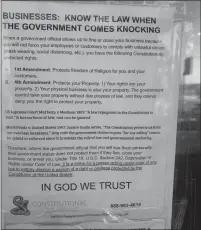  ??  ?? A sign on the front door of the Aloha Coffee and Cafe in Monterey reflects what the owner says are violations of his Constituti­onal rights.