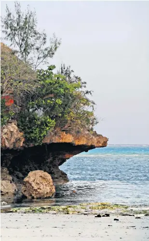  ?? ?? i Ocean colour scene: try local dishes at the Rock in Zanzibar