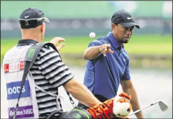  ?? GETTY IMAGES ?? Tiger Woods wasn’t pleased about needing 33 putts Thursday. “I left probably about 16 putts short. I just couldn’t get the speed of these (greens),” he said.