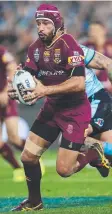  ??  ?? MAROON MAGIC: Johnathan Thurston on the State of Origin stage against NSW.