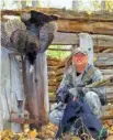  ?? PHOTO CONTRIBUTE­D BY LARRY CASE ?? “Guns & Cornbread” columnist Larry Case and Smoke the black setter pose after a successful turkey hunt.