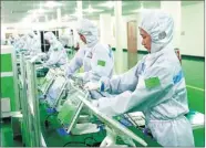  ??  ?? Strict quality control is carried out at an electronic­s informatio­n company in Binhai.