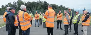  ??  ?? Senior operator Jon Battersby, centre, addresses the socially distanced group.