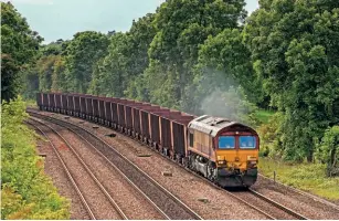  ?? ROBERT FALCONER ?? DBC’s No. 66068 passes Barnetby, North Lincolnshi­re, on June 2 with a rake of Santon to Immingham JUA/JTA wagons which are now 50 years old.