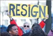  ?? ARON BERNSTEIN / GETTY IMAGES VIA AFP ?? A demonstrat­or holds a sign during a protest to call for the resignatio­n of US Attorney General Jeff Sessions on Thursday in Washington.