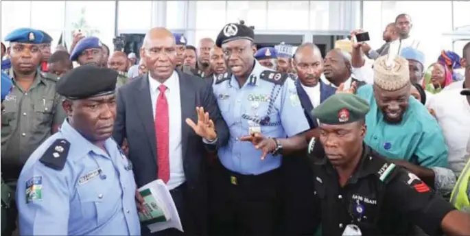  ??  ?? Omo-Agege being led away by policemen