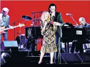  ??  ?? Rock’s most stylish: Nick Cave and Kylie Minogue, wearing The Vampire’s Wife, on stage in London on Sunday, left; Michelle Dockery, right, and Rosanna Arquette, below
