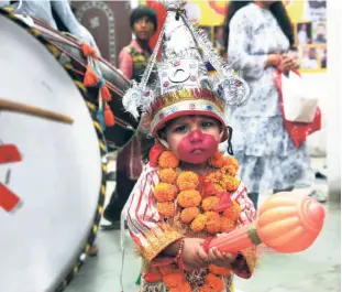  ?? ?? PARENTS BELIEVE that if their children pray at the temple during Navratri dressed as langurs they will have Hanuman’s blessings for the rest of their lives..