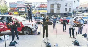  ?? AP ?? Members of the NY Phil Bandwagon perform in Queens, New York on Monday.