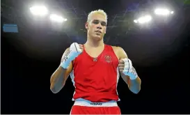  ?? PHOTOSPORT ?? Hamilton heavyweigh­t David Nyika is assured of a medal after his quarterfin­al opponent failed to appear for their bout.