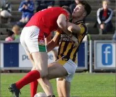  ??  ?? Eoghan Nolan clashes with county colleague Nick Doyle during the 2-16 to 0-12 semi-final victory against Starlights.