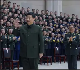  ?? LI GANG — XINHUA VIA AP ?? Chinese President Xi Jinping waves as he meets with military officers stationed in north China’s Tianjin Municipali­ty on Friday in north China’s Tianjin Municipali­ty.