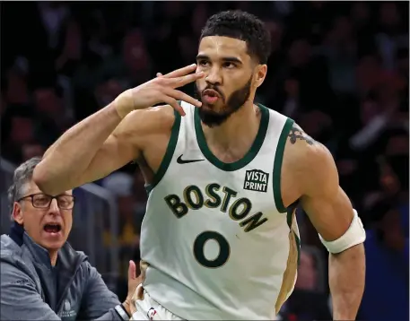  ?? STAFF PHOTO — STUART CAHILL/BOSTON HERALD ?? Boston Celtics forward Jayson Tatum celebrates after sinking a 3-pointer as the Celtics defeated the Pacers at the TD Garden. The Celtics have 27 games before the playoffs start.
