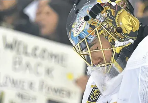  ?? Peter Diana/Post-Gazette ?? Marc-Andre Fleury reflects as a video tribute video to him is played in the first period Tuesday night at PPG Paints Arena.