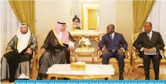  ??  ?? Deputy Prime Minister and Foreign Minister Sheikh Sabah Khaled Al-Hamad Al-Sabah meets with Ivorian Minister of Foreign Affairs Marcel Tanoh.