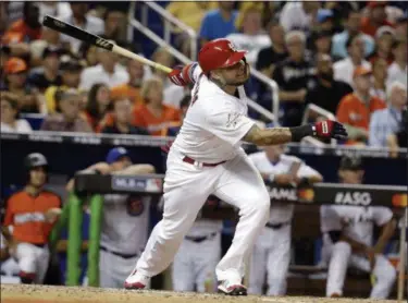  ?? LYNNE SLADKY — THE ASSOCIATED PRESS ?? National League’s St. Louis Cardinals catcher Yadier Molina (4), hits a homerun in the sixth inning, during the MLB baseball All-Star Game on Tuesday in Miami.