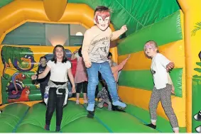  ?? ?? Jump around The bouncy castle was a hit with the kids