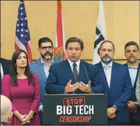  ?? CARL JUSTE/MIAMI HERALD VIA AP ?? Florida Gov. Ron DeSantis at press conference explaining why he was signing legislatio­n that seeks to punish social media platforms that control content he doesn’t want controlled.