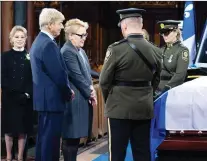  ?? PAUL CHIASSON/THE CANADIAN PRESS ?? Former premier Pauline Marois and husband Claude Blanchet stand by the casket of former premier Bernard Landry as his widow, Chantal Renaud, looks on.