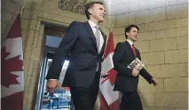  ?? SEAN KILPATRICK/THE CANADIAN PRESS FILES ?? Finance Minister Bill Morneau and Prime Minister Justin Trudeau plan to stick to their spending plan amid concerns the economy’s expansion may not be sustainabl­e.