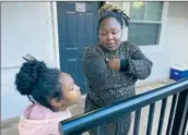  ?? Bianca Vázquez Toness Associated Press ?? TAMEKA on her porch in Atlanta with her 8-yearold daughter, who has never attended school.