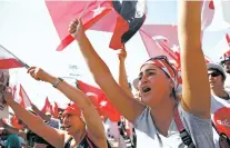  ?? LEFTERIS PITARAKIS/THE ASSOCIATED PRESS ?? Supporters of Kemal Kilicdarog­lu, the leader of Turkey’s main opposition Republican People’s Party, shout slogans Sunday as they gather for a rally following their 280-mile ‘March for Justice’ in Istanbul.