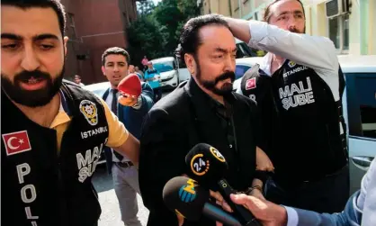  ?? Photograph: Dogan news agency/AFP/Getty Images ?? Adnan Oktar during his arrest in 2018. He told the judge he had close to 1,000 girlfriend­s.