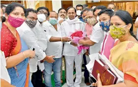  ??  ?? TRS MLAs and ministers congratula­te Chief Minister K. Chandrashe­kar Rao after the new Land Revenue Bill was passed in the Assembly on Friday.