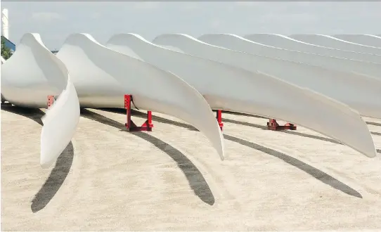  ?? MIKE HENSEN ?? Giant wind turbine blades sit outside the Siemens plant in Tillsonbur­g, Ont., after employees learned the plant is closing and putting more than 340 people out of work.