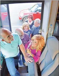  ?? STACI VANDAGRIFF/TRILAKES EDITION ?? Members of the gospel group Heaven’s Echoes make their way onto their tour bus. Leading the way are, in front, Dwayne Ward and Judy Biggers; middle row, from left, Gus Biggers, Vickie Williams and Steve Williams; and in back, Debbie Ward. The group recently won the Inspiratio­nal Artist of the Year title.