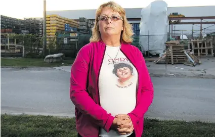  ?? DAN JANISSE/The Windsor Star ?? Tammy Lewis stands in front of the Narmco Group factory Tuesday. Her sister Cindy Libby was killed in an industrial accident seven years ago at the Prince Metal Products Ltd. plant. She wants better safety measures to protect workers.