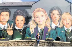  ?? Photos / Supplied ?? Mel Homer in front of a mural of the Derry Girls and below, kayaking on Lough Erne. Right: Epic, the Irish Emigration Museum in Dublin.