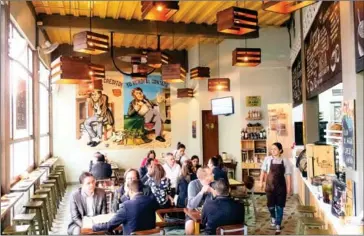  ?? JORGE PANCHOAGA/THE NEW YORK ?? Inside Misia, a restaurant that showcases the popular cuisine of Colombia’s Caribbean coast, in Bogotá, on January 19. As Bogotá has increasing­ly become a melting pot of cultures from every part of Colombia, restaurant­s focusing on regional dishes and...