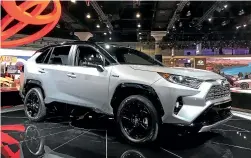  ??  ?? A hybrid version of the new Toyota RAV4 sits on display at the Los Angeles Motor Show.