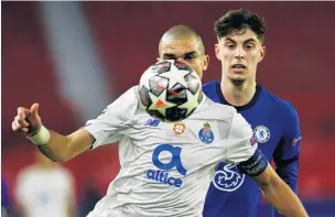  ?? PHOTO: REUTERS ?? FC Porto’s Pepe controls the ball in front of Chelsea’s Christian Pulisic during a Champions League quarterfin­al, second leg match in Seville, Spain, yesterday.