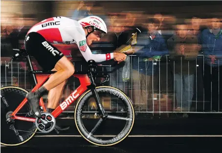  ?? PHOTOS: GETTY IMAGES/FILES ?? Switzerlan­d’s Stefan Kung competes July 1 in a 14-kilometre individual time trial during the first stage of the 104th edition of the Tour de France. Riders at the front of the pack during the time trial stages of the race have powerful bodies built for...