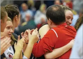  ?? AUSTIN HERTZOG - DIGITAL FIRST MEDIA ?? Boyertown head coach Jason Bieber hugs Abby Kapp after giving her a first place medal following the Bears’ victory over North Allegheny in the PIAA Class 6A title game.