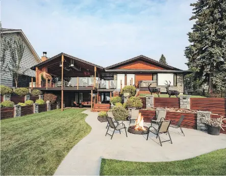  ??  ?? Firepits and fireplaces help warm up the ambience in this outdoor living space by Ultimate Homes and Renovation­s.