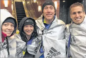  ?? SUBMITTED ?? P.E.I. runners, from left, Amber Spriggs, Jocelyn Peterson, Mike Peterson and Stan Chaisson are wrapped in blankets to keep warm and happy after running the Boston Marathon on Monday in Boston, Mass. Chaisson, who’s from Charlottet­own, was the top...