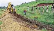  ?? HT PHOTO ?? An earthmover dug up 70 meters at the Bagbera Water Plant project site near Giddijhopr­i vilage amidst heavy police deployment.