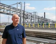  ?? DIGITAL FIRST MEDIA FILE PHOTO ?? Jonathan Hunt, senior director of terminal operations for Sunoco Logistics, stands in front of a metering station for the Mariner East 1 pipeline at the Sunoco Logistics refinery in Marcus Hook.