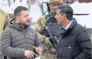 ?? AFP ?? Ukrainian President Volodymyr Zelensky and British Prime Minister Rishi Sunak visiting the exhibition of destroyed Russian military vehicles in Kyiv, amid Russia’s invasion of Ukraine, on Saturday.