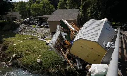  ??  ?? Flash flood in Waverly, Tennessee, swept houses off their foundation­s. Photograph: Brett Carlsen/Getty Images