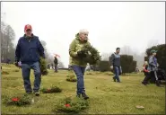  ?? LAUREN A. LITTLE — MEDIANEWS GROUP ?? (L-R) Robert and Christine Keeler of Wyomissing lay wreaths during Wreaths Across America at Forest Hills Memorial Park Dec. 14.