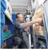  ?? ORLANDO SENTINEL ?? Harvey Vives places food into an oven inside a state-of-the-art delivery truck to make a delivery for the East End Market on April 3.