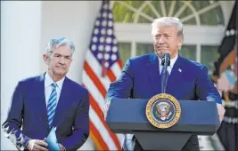  ?? Alex Brandon The Associated Press file ?? President Donald Trump on Wednesday said he “made” Fed chief Jerome Powell, seen at left, but now would like to trade him in for Mario Draghi, the head of the European Central Bank, who has said he is prepared to provide more economic stimulus.
